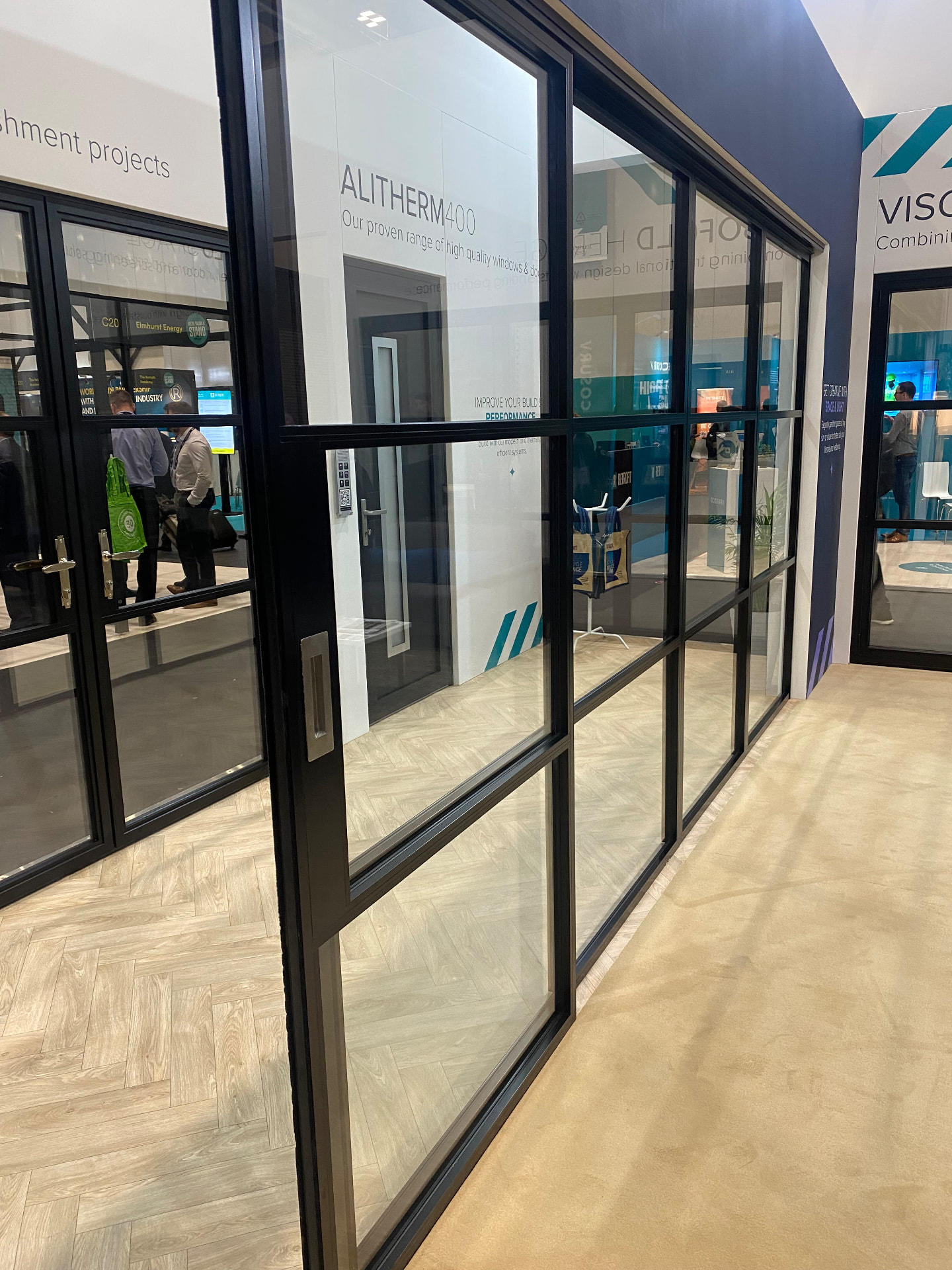 Black aluminium sliding internal screen run at an exhibition stand